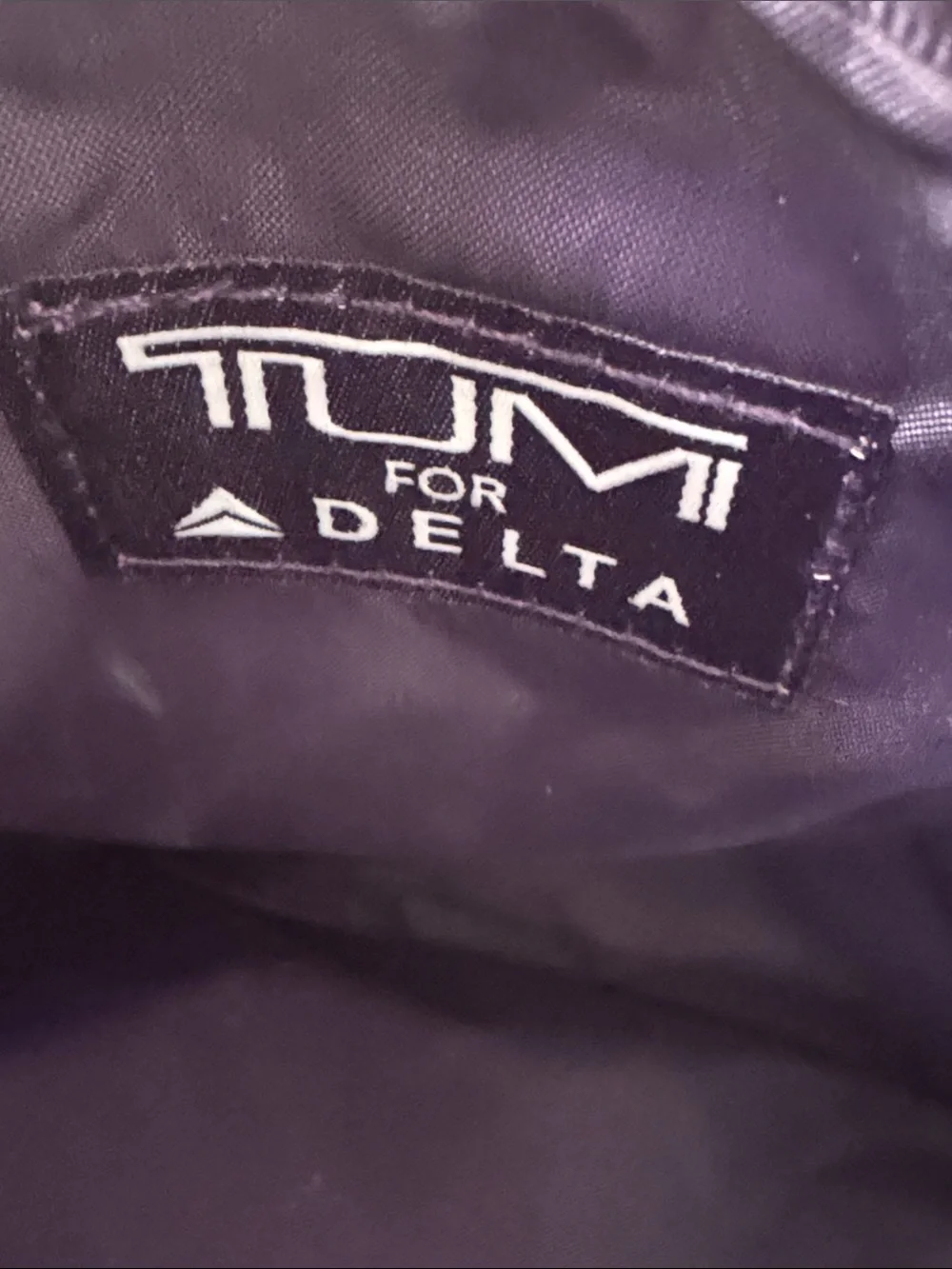 Tumi Silver and Black Toiletry Pouch – Compact Travel Organizer
